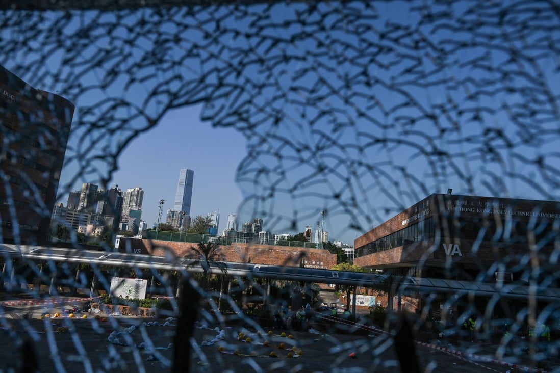 The ICC (International Commerce Centre) is seen in the distance through damaged glass at Hong Kong Polytechnic University. The campus became the focal point of some of the worst violence in more than five months of anti-government protests. Photo: AFP