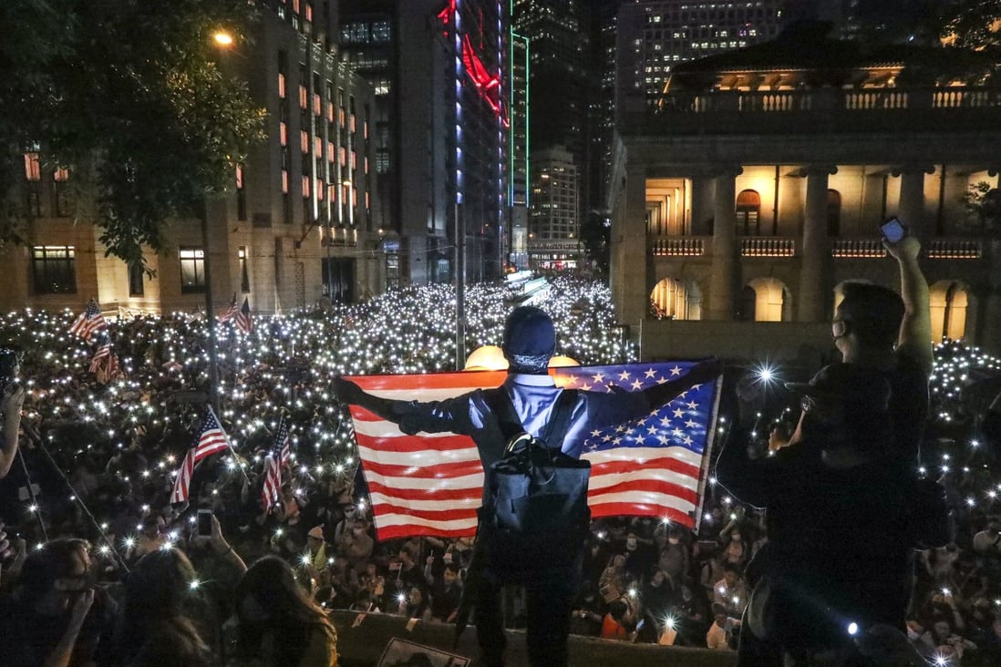 Anti-government protesters wave a US flag during a rally at Chater Garden in Central on October 14, as they urge the US Congress to pass the Hong Kong Human Rights and Democracy Act. Photo: Felix Wong