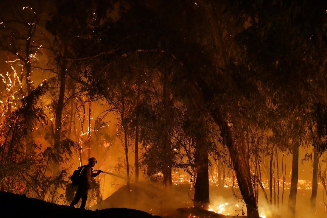 A firefighter battles a blaze in California. Photo: AP
