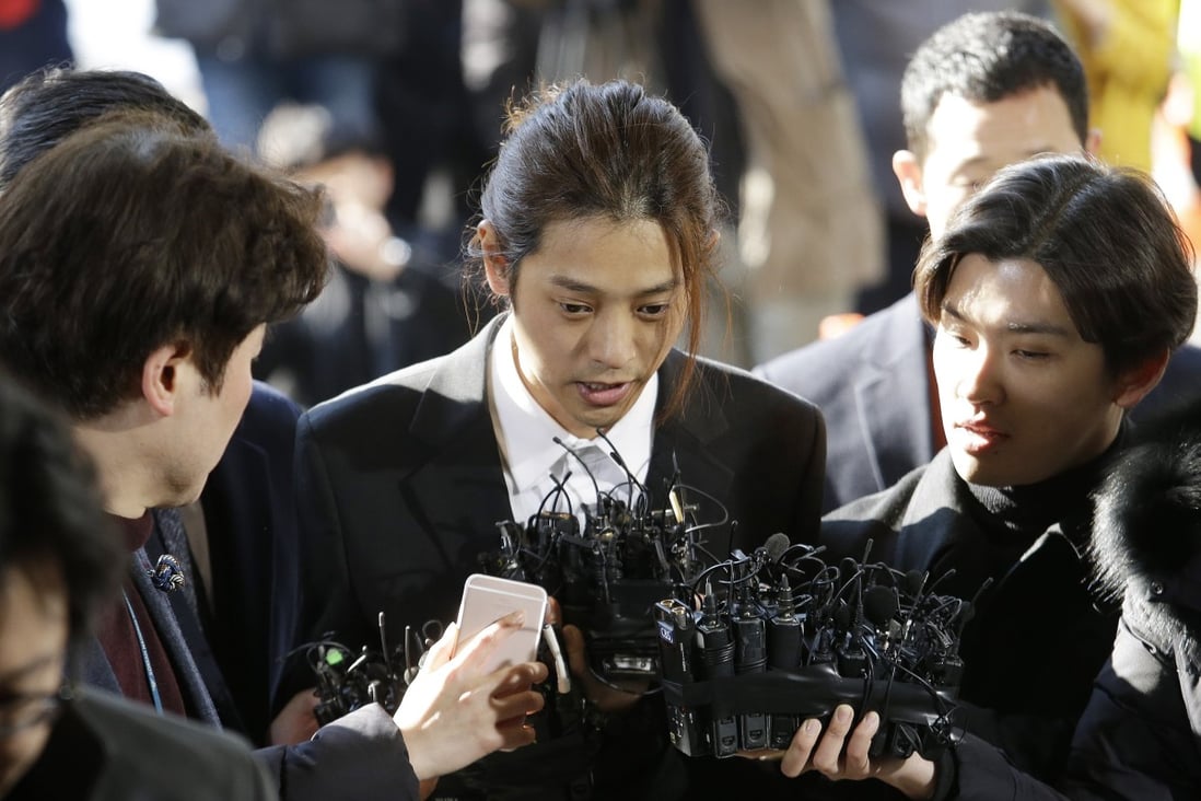 K-pop singer Jung Joon-young, pictured here speaking upon his arrival at the Seoul Metropolitan Police Agency in March, received a six-year prison term for gang-raping two different victims on two occasions in 2016, and filming himself having sex with other women without their knowledge and sharing the footage without their consent. Photo: AP