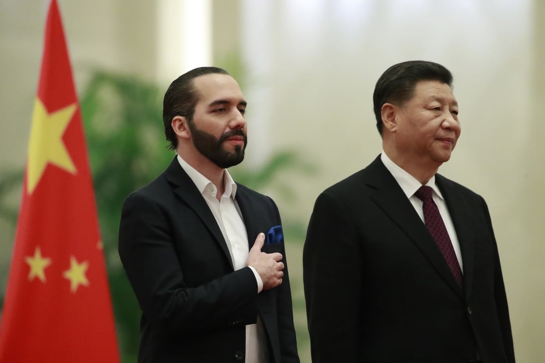 Salvadoran President Nayib Bukele (left) and Chinese leader Xi Jinping stand for their national anthems during a ceremony in Beijing on Tuesday. Photo: EPA-EFE