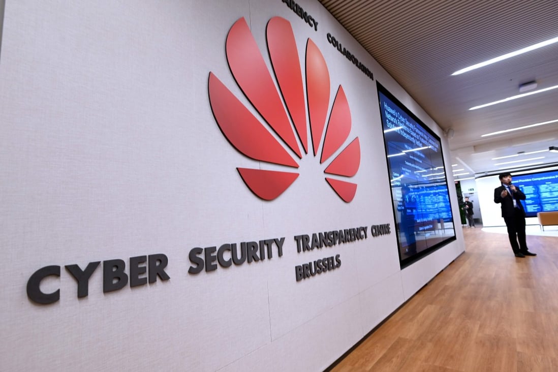 A Huawei employee welcoming guests at Huawei's European Cyber Security Transparency Centre during its opening in Brussels. Photo: AFP
