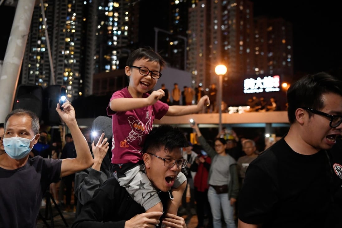 Young and old celebrate the results of the Hong Kong district council elections, in Wong Tai Sin on November 30. Photo: Reuters
