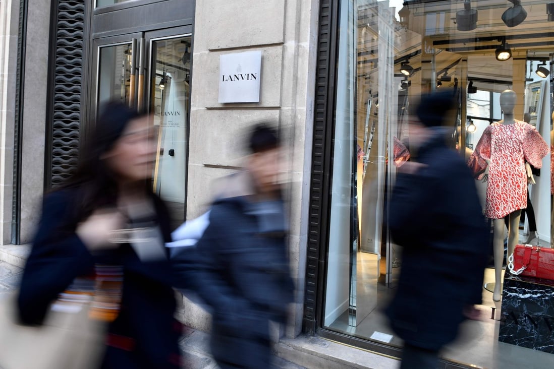 Pedestrians walk past a Lanvin shop on the Rue du Faubourg Saint-Honore in Paris. Fosun bought the ailing French fashion label with a promise to revive its fortunes. Photo: AFP