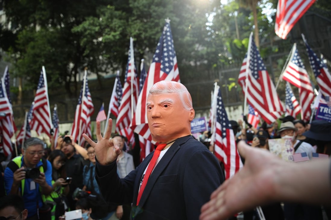 A Donald Trump impersonator among the hundreds gathered at Chater Garden on December 1 to celebrate the enactment of the Hong Kong Human Rights and Democracy Act. Photo: Winson Wong