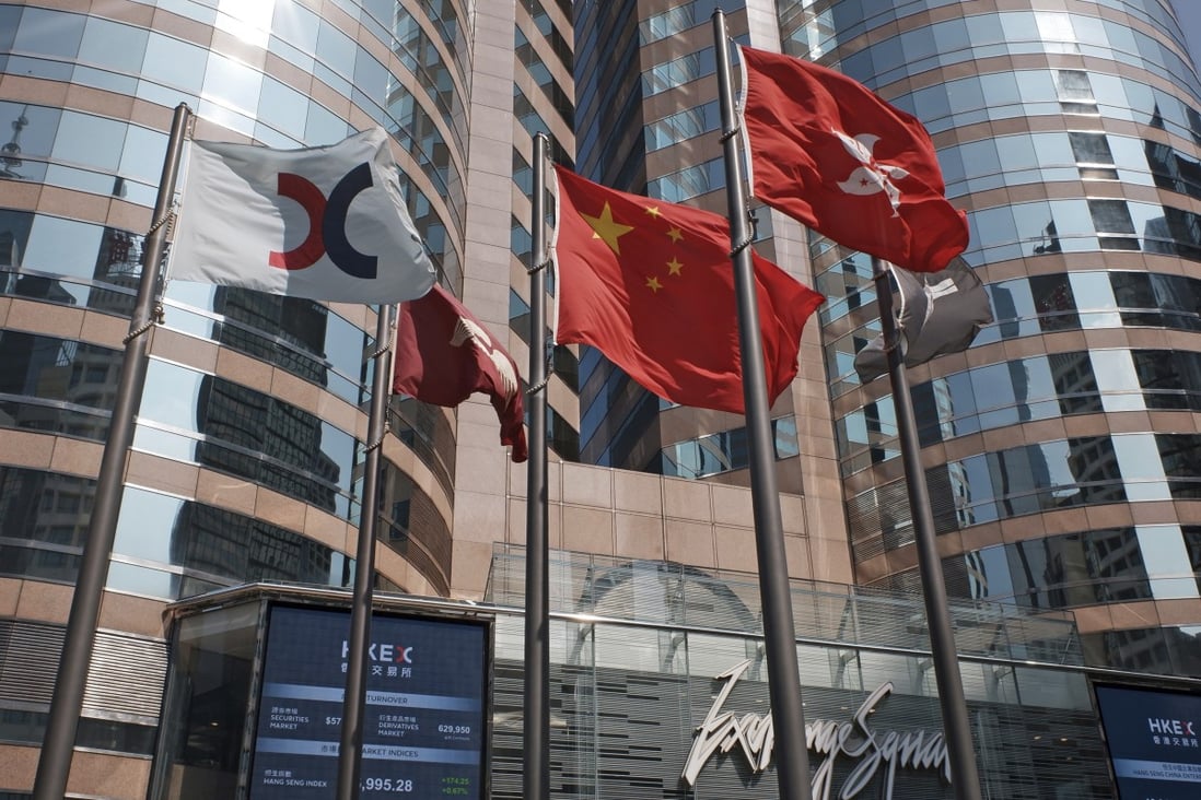 Flags are raised outside the Exchange Square building in Central. Photo: AP