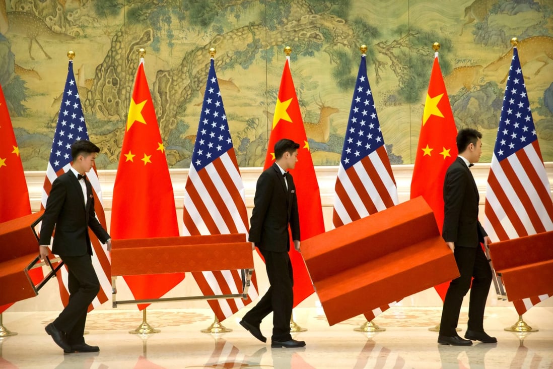 Aides preparing for a group photo of US and Chinese trade negotiators in Beijing earlier this year, when hopes were high an agreement would soon be reached. Photo: Reuters