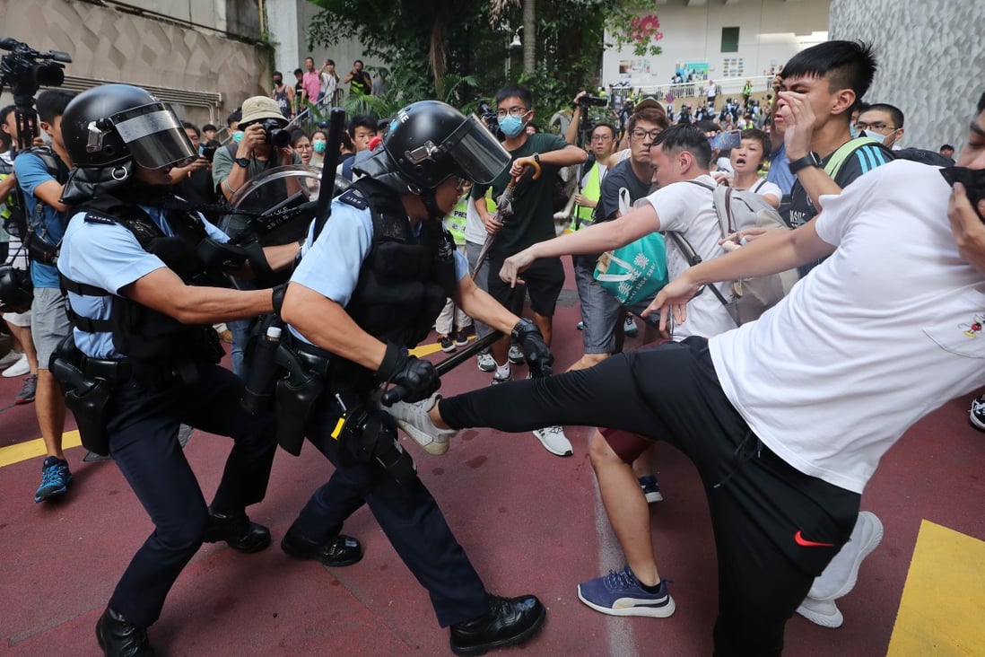 Police and anti-government protesters clash at Amoy Plaza in Kowloon Bay. The ongoing protests have hit businesses across Hong Kong. Photo: Sam Tsang