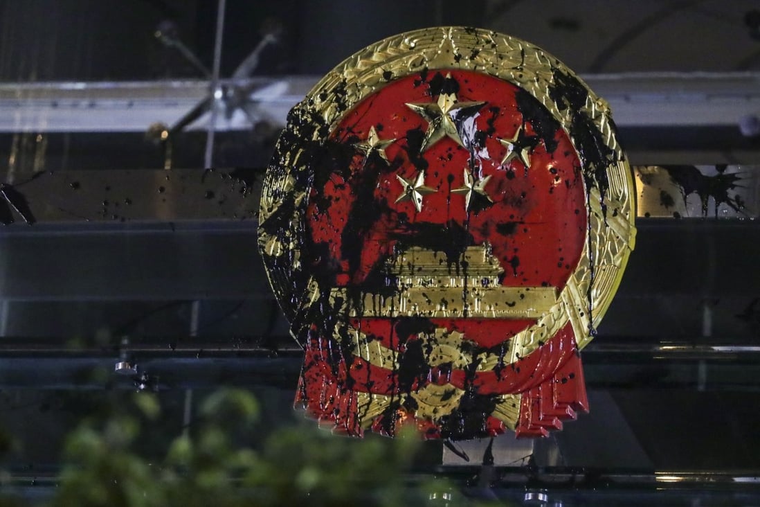 The Chinese national emblem outside Beijing’s liaison office in Hong Kong was vandalised on July 21 during a march organised by the Civil Human Rights Front against the now withdrawn extradition bill. The incident triggered Chinese media to end its silence on the Hong Kong protests. Photo: Edmond So