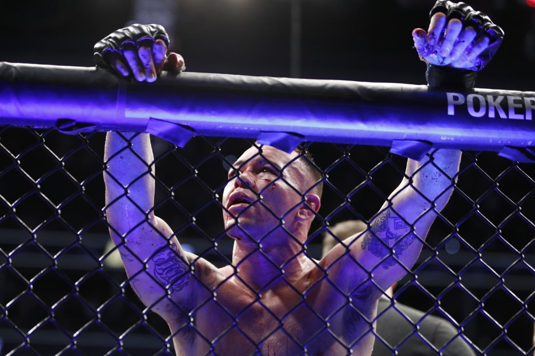 Colby Covington leans against the fence after losing to Kamaru Usman at UFC 245. Photos: AP