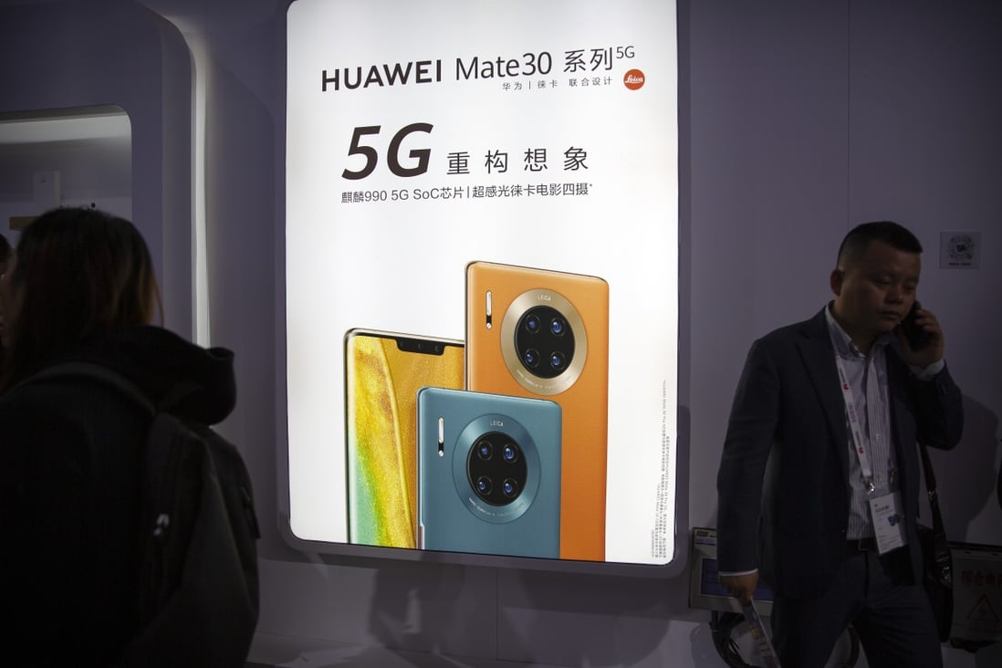 Advertisement for the Huawei Mate 30 phone, which boasts of its own chips and operating system with reportedly no US parts, is seen at a trade expo in Beijing on October 31. Companies subject to US sanctions, such as ZTE and Huawei, have ramped up the development of in-house substitutes for US components. Photo: AP