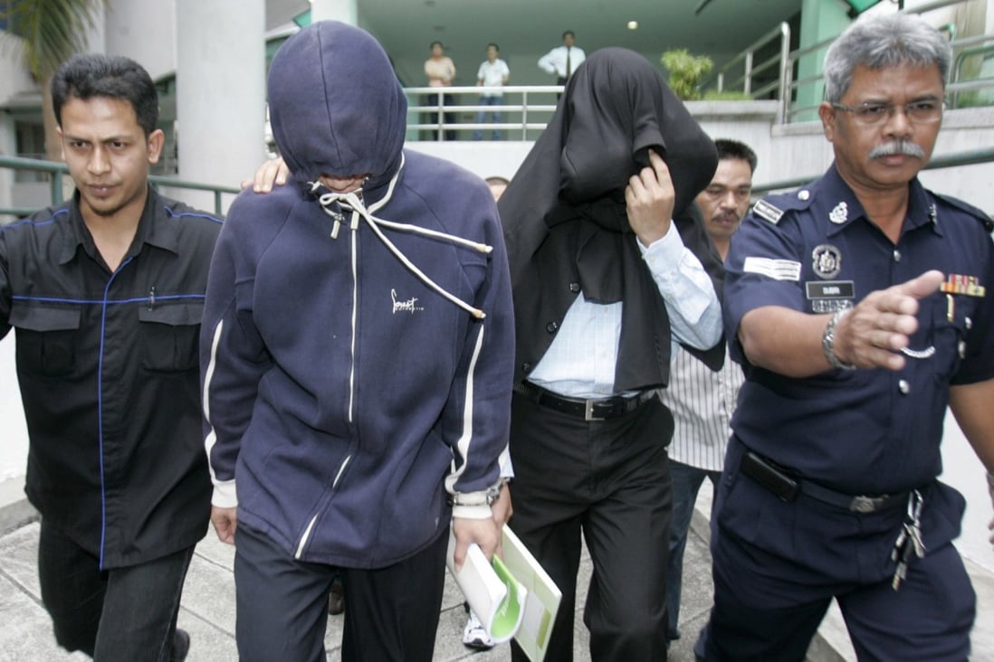 Policemen Azilah Hadri and Sirul Azhar Umar arrive at court. In 2009 both were convicted and sentenced to death. Photo: Reuters