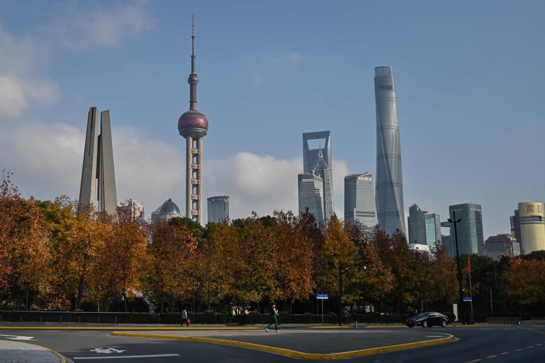The skyline of the Lujiazui financial district in Shanghai on December 16. China must not wait until its GDP growth rate falls below 6 per cent before taking more aggressive action, as it might be too late by then to avert the downward trend. Photo: AFP