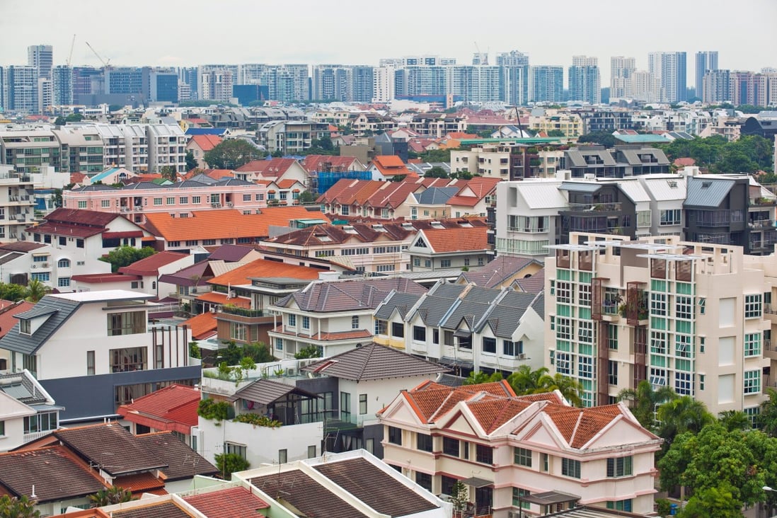 Private residential buildings, foreground, stand in the Kembangan area of Singapore. Photo: Bloomberg