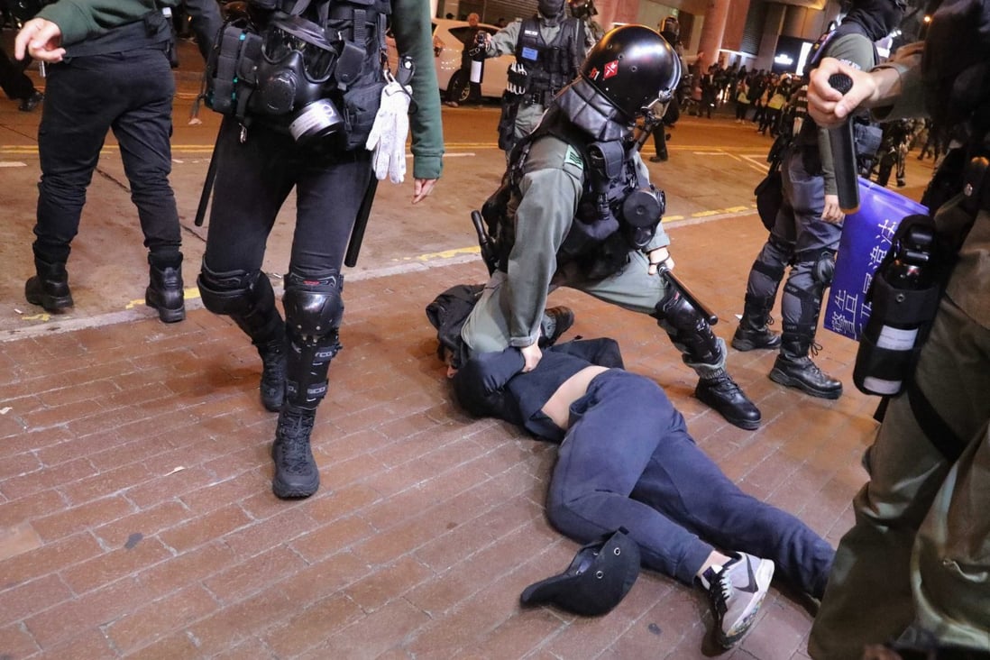 Police arrest a protester in Mong Kok on Christmas Day. Photo: Felix Wong