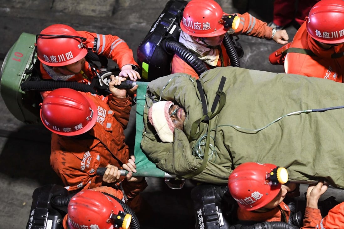 Rescuers carry a survivor of a flooding accident in a coal mine in Sichuan province last week. Photo: Xinhua
