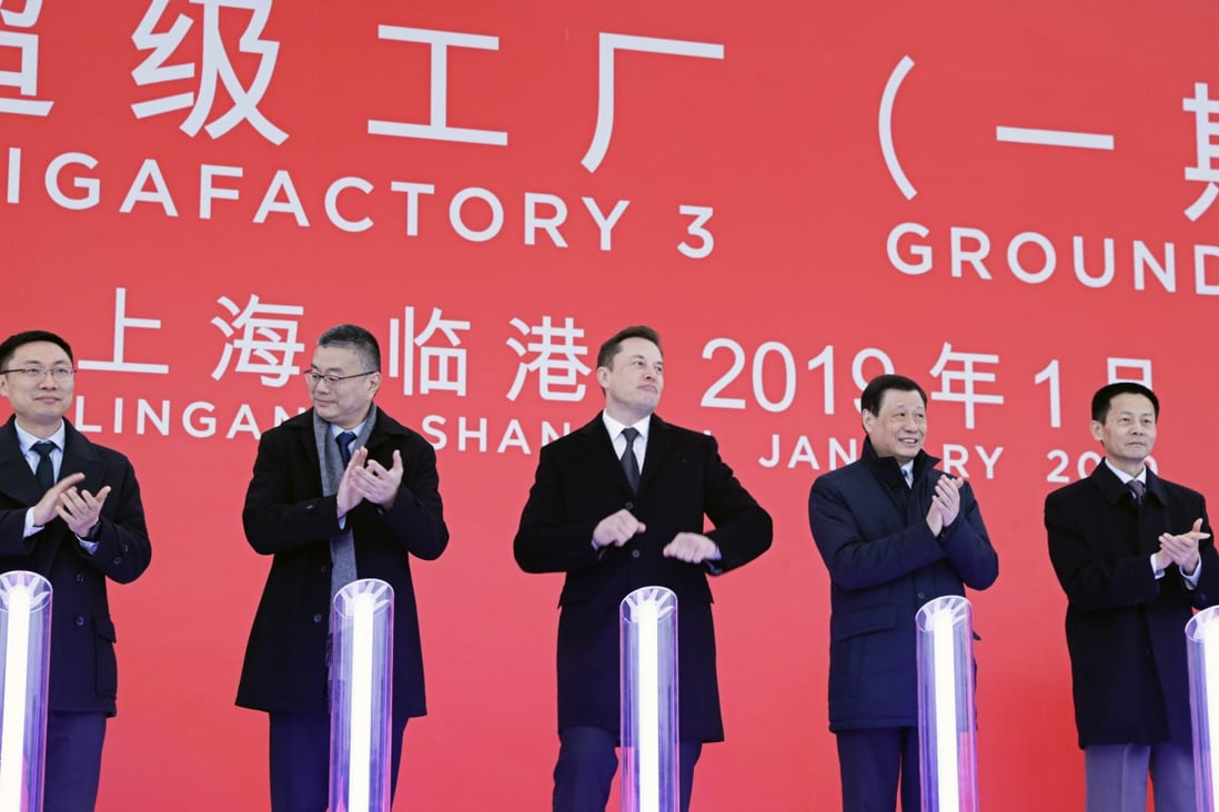Elon Musk, chief executive officer of Tesla (Centre) with Robin Ren, vice-president of sales, second left, Ying Yong, mayor of Shanghai, second right, and Wu Qing, vice mayor of Shanghai, right, at an event at the company’s manufacturing facility in Shanghai in January 2019. Photo: Bloomberg