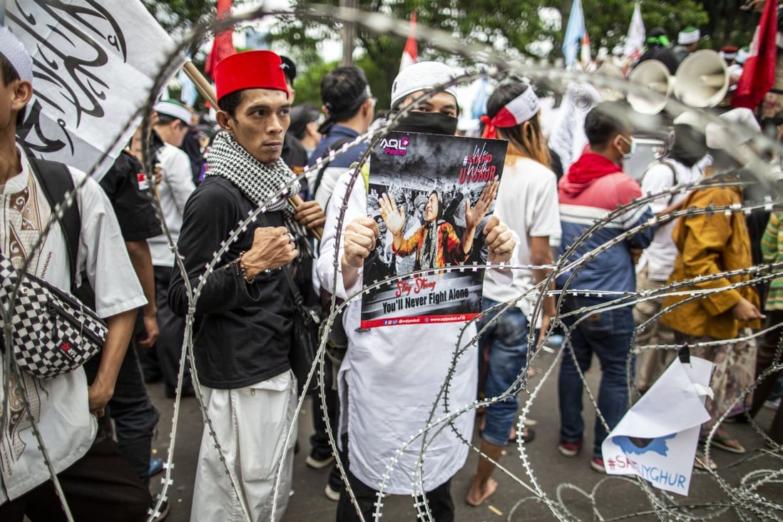 Indonesian Muslims gather in front of China’s embassy in Jakarta on Friday to protest against the repression of Uygurs in Xinjiang. Photo: dpa