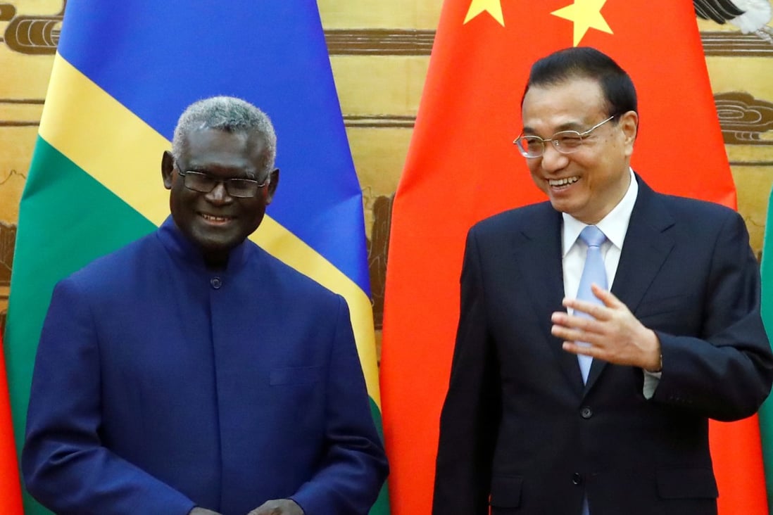 Solomon Islands Prime Minister Manasseh Sogavare and Chinese Premier Li Keqiang at an October signing ceremony at the Great Hall of the People in Beijing. Photo: Reuters