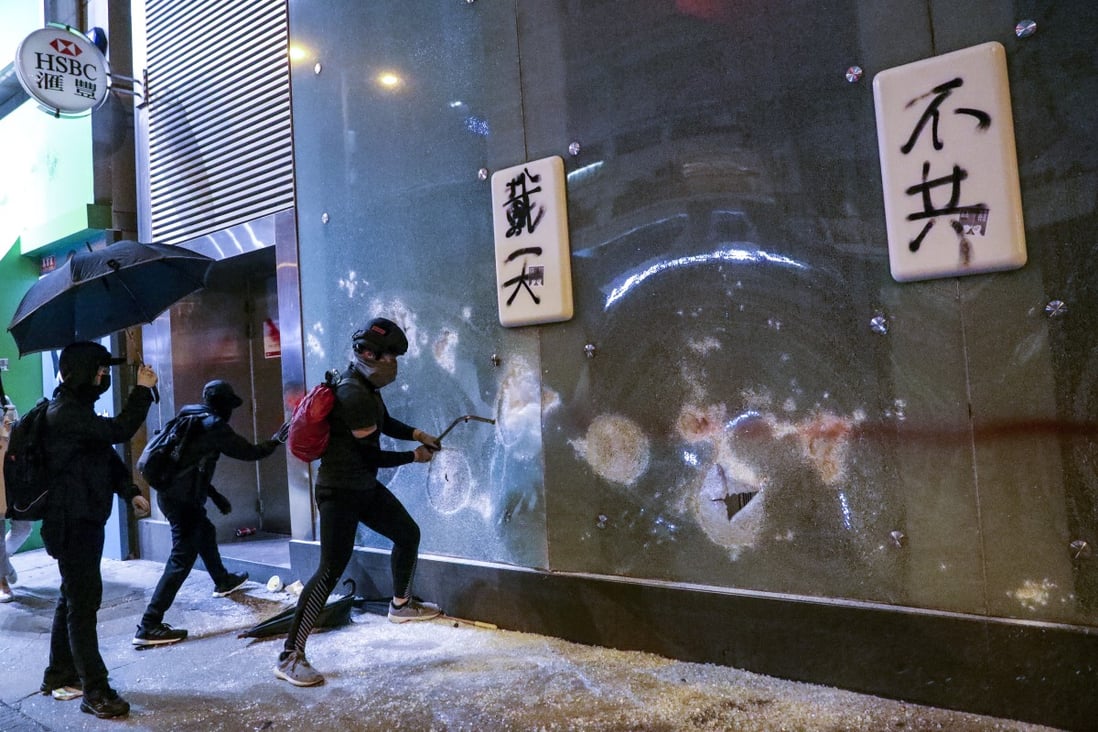 An HSBC branch is vandalised by protesters in Mong Kok on Christmas Day. HSBC became a target after Hong Kong police froze crowdfunded capital from a corporate account held by Spark Alliance HK, a non-profit organisation set up in 2016 to help protesters. Photo: May Tse