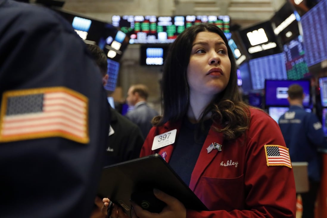 A trader works on the floor of the New York Stock Exchange on December 13. After a year rocked by the trade war and fears of a hard Brexit, stock market investors have much to look forward to in 2020. Photo: AP