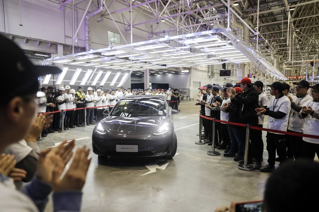 A Tesla Model 3 vehicle set to be delivered to a company employee moves off an assembly line during a ceremony at the company's Gigafactory in Shanghai. Photo: Bloomberg