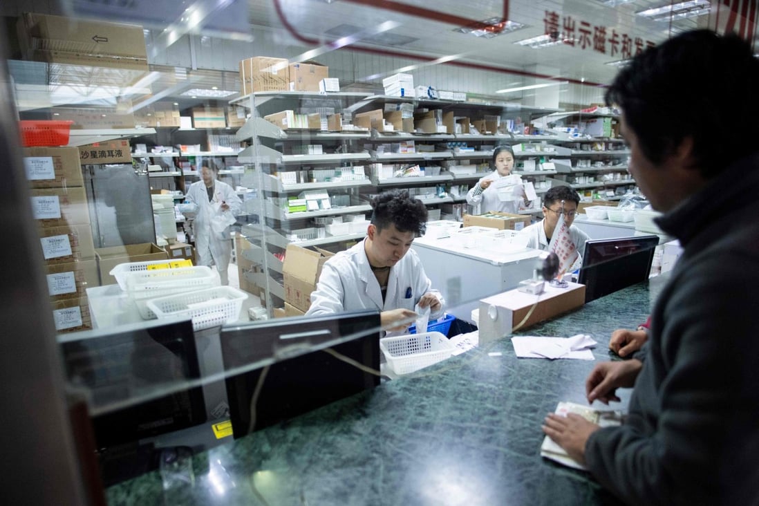 Employees work in the pharmacy of the Yueyang Hospital, part of the Shanghai University of Traditional Chinese Medicine, in Shanghai. Photo: AFP