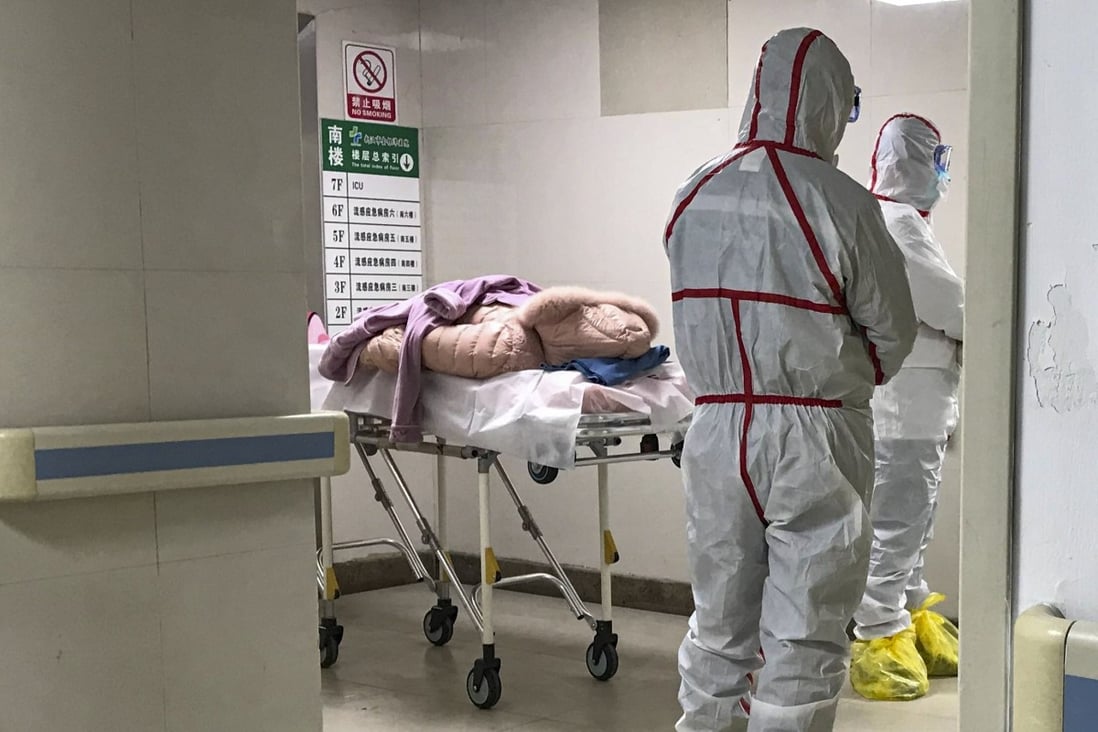 Staff in protective clothing at the hospital in Wuhan where patients are being treated. Photo: Jun Mai