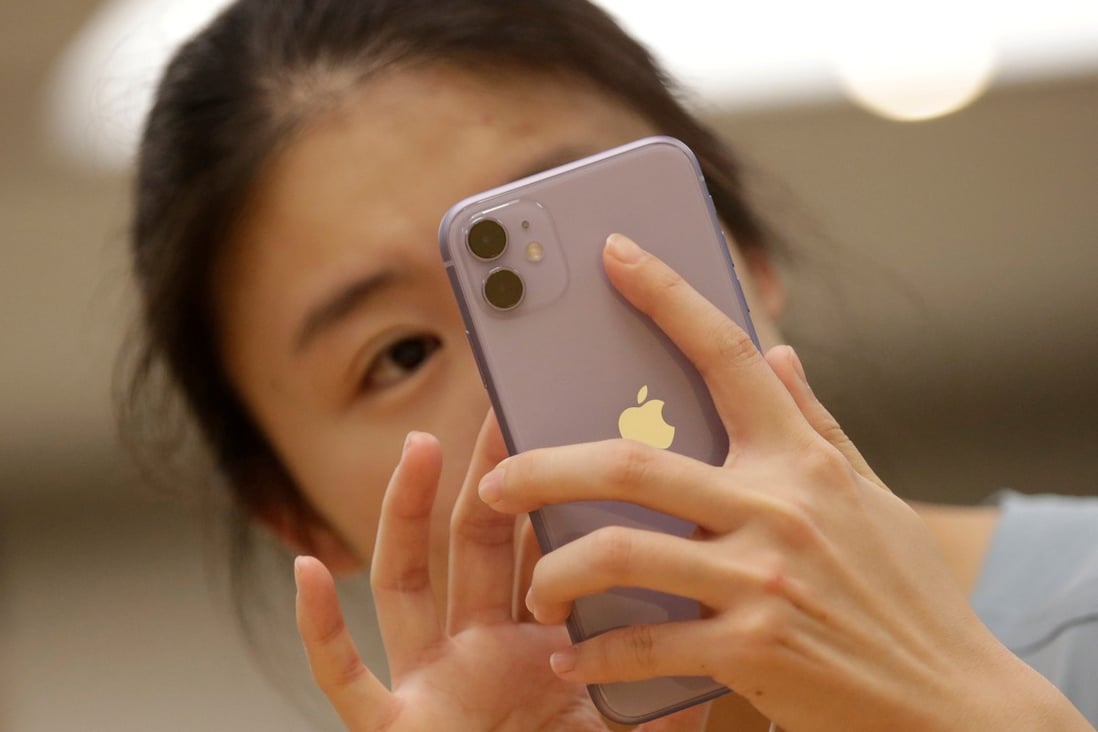 A customer tests Apple's iPhone 11 after it went on sale at the Apple Store in Beijing on September 20. Photo: Reuters