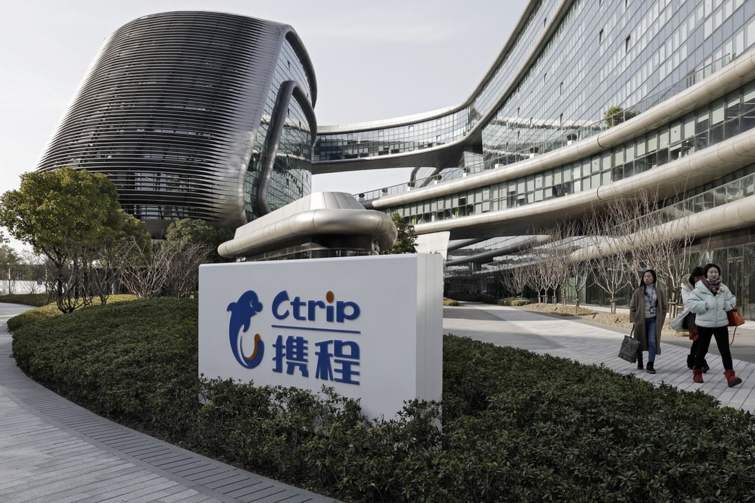 A sign for online travel services provider Ctrip is displayed outside the Sky Soho Building, which hosts the company's headquarters in Shanghai. Photo: Bloomberg