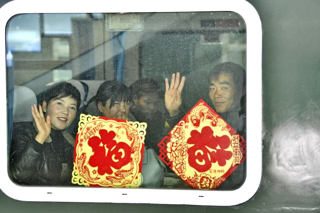 Passengers wavethrough the train window at the Lhasa Railway Station on January 10, 2020, the first day of the Spring Festival travel season. Photo: Xinhua