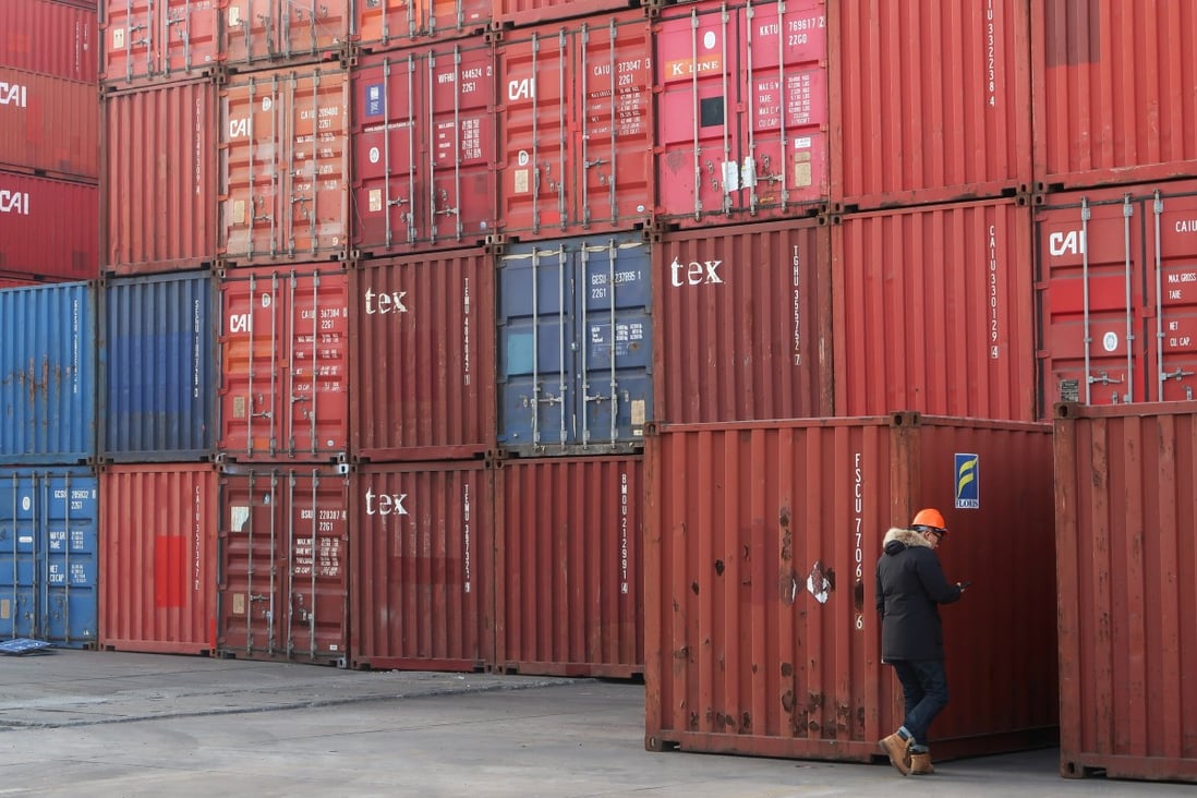 A worker checks containers at a logistics centre near Tianjin port, in Tianjin, China December 12, 2019. Picture taken December 12, 2019. Photo: Reuters
