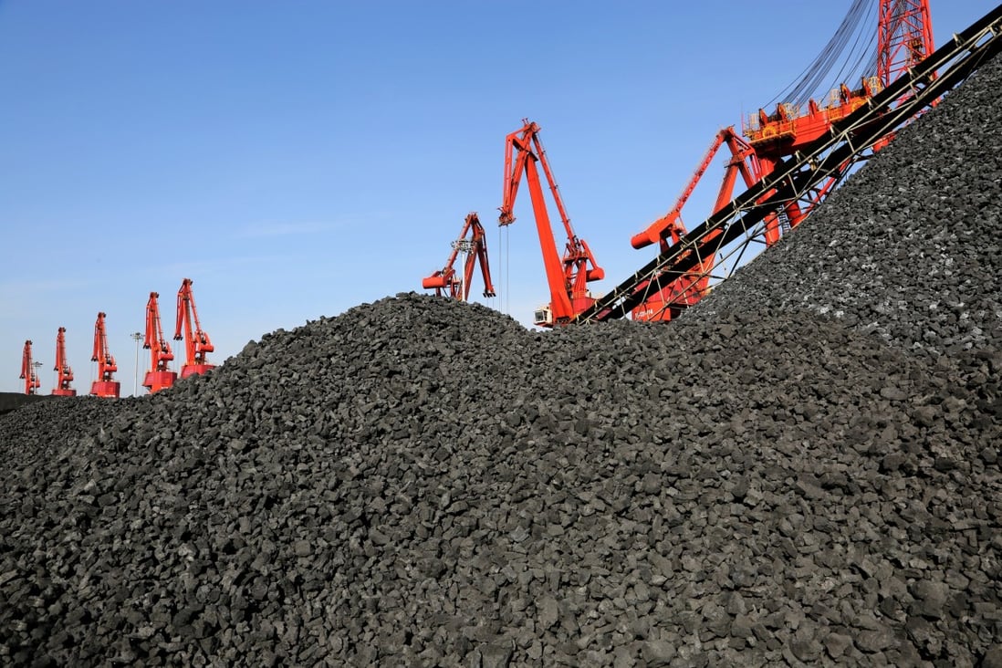 Cranes unload coal from a cargo ship at a port in Lianyungang, Jiangsu province, China. Thermal coal producers will come under more scrutiny from BlackRock. Photo: Reuters