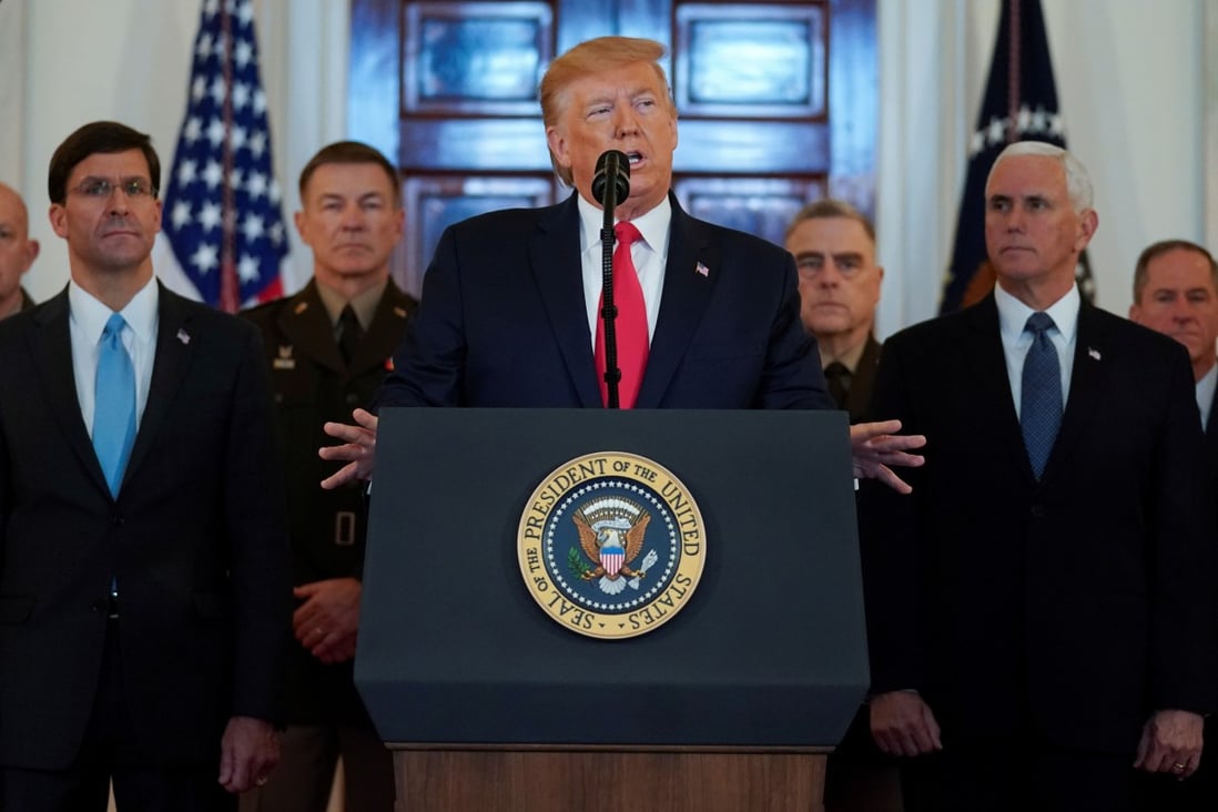 US President Donald Trump delivers a statement about Iran, flanked by Secretary of Defence Mark Esper, Vice-President Mike Pence and military leaders, in the grand foyer of the White House on January 8. Photo: Reuters