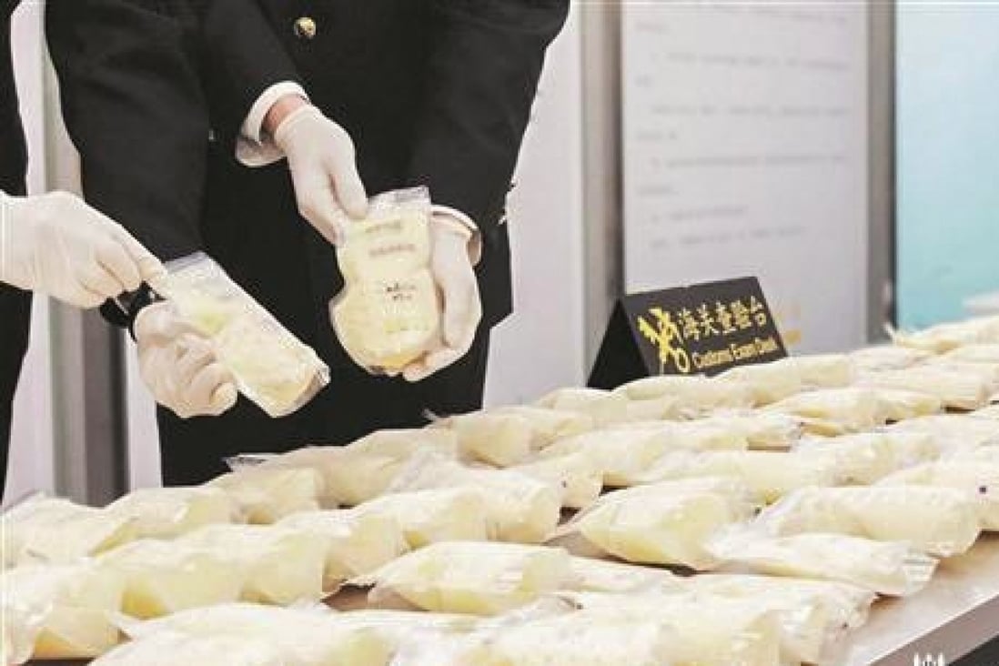 Quanzhou customs officers destroyed 23kg of frozen breast milk found in the luggage of a Chinese traveller. Photo: Handout