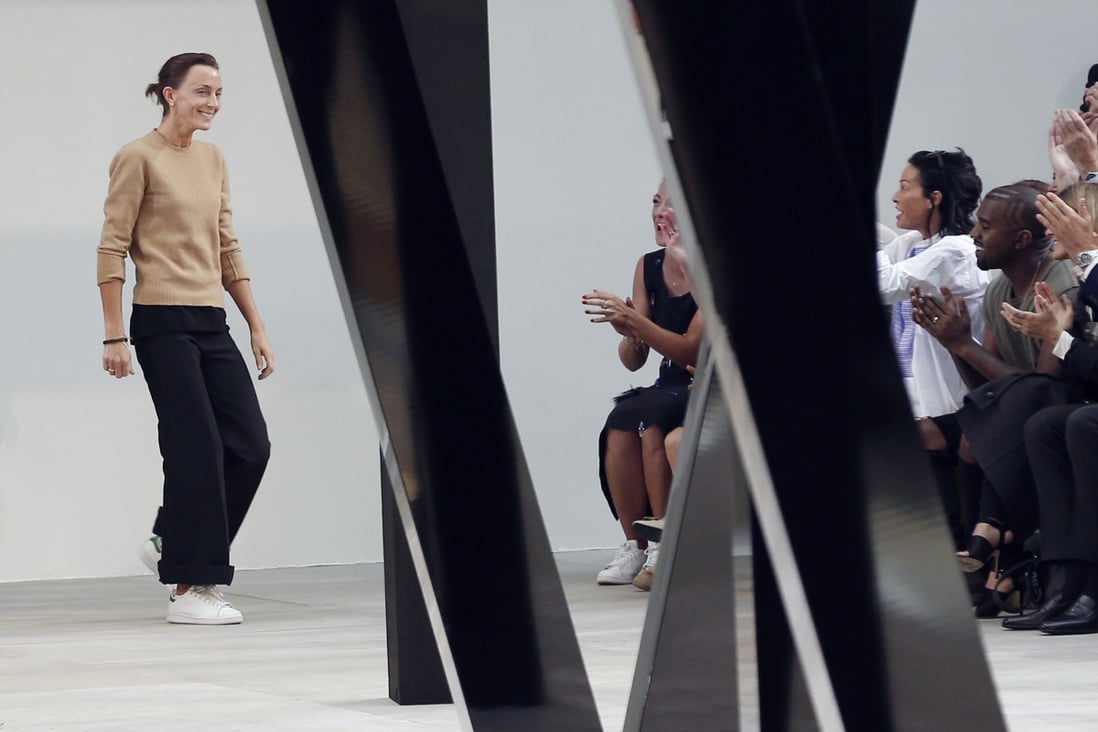 Phoebe Philo sports trainers as she takes a bow at the end of the Celine 2015 spring/summer show in Paris on September 28, 2014. Photo: Francois Guillot/AFP via Getty Images