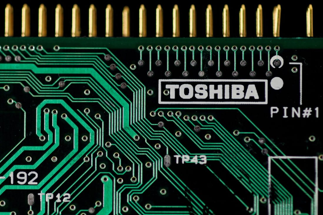 A logo of Toshiba Corp is seen on a printed circuit board in this photo illustration taken in Tokyo. Photo: Reuters