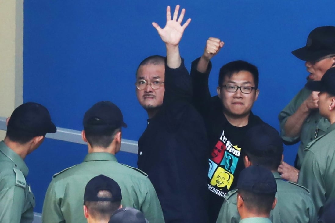 Legislator Shiu Ka-chun (left) and activist Raphael Wong Ho-ming are taken into the Lai Chi Kok Detention Centre to start their jail sentences. Photo: Robert Ng