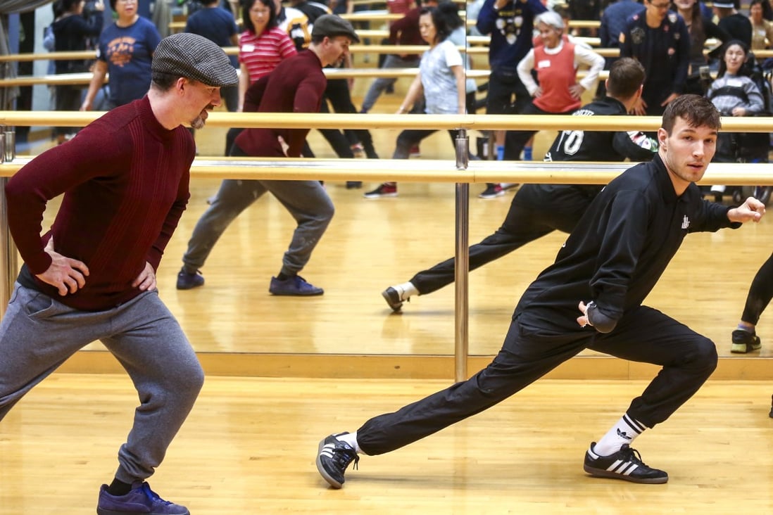 Redouan Ait Chitt (left), member of international breakdance group ILL-Abilities at a workshop at Tin Shui Wai. Photo: Jonathan Wong