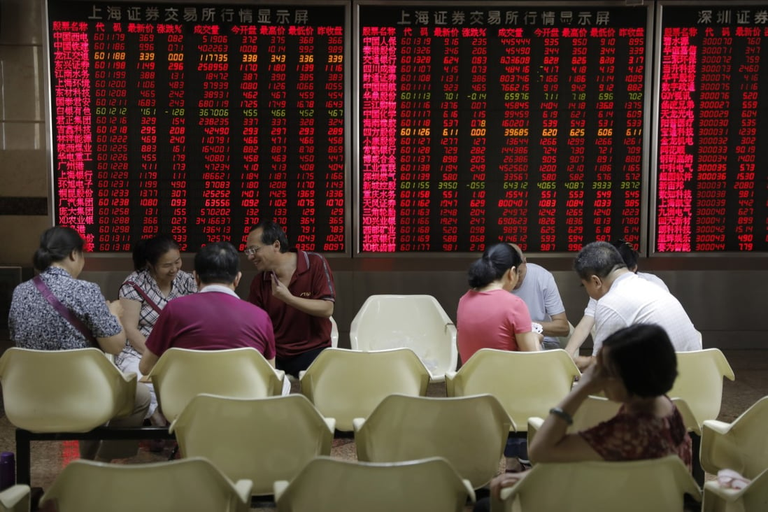 Chinese investors checking on stock prices on electronic board in the hall of a securities brokerage house in Beijing, China on June 19, 2019. Photo: EPA-EFE