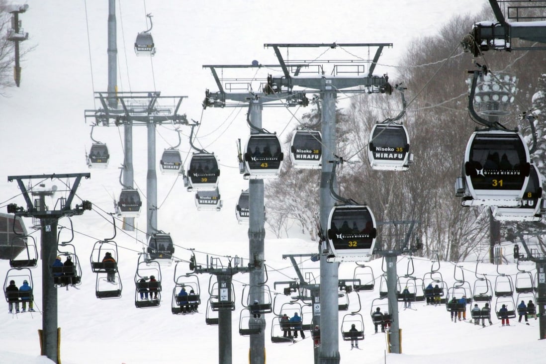 Skiers and snowboarders ride the lift at a ski resort in Hirafu village, Niseko. Photo: Bloomberg
