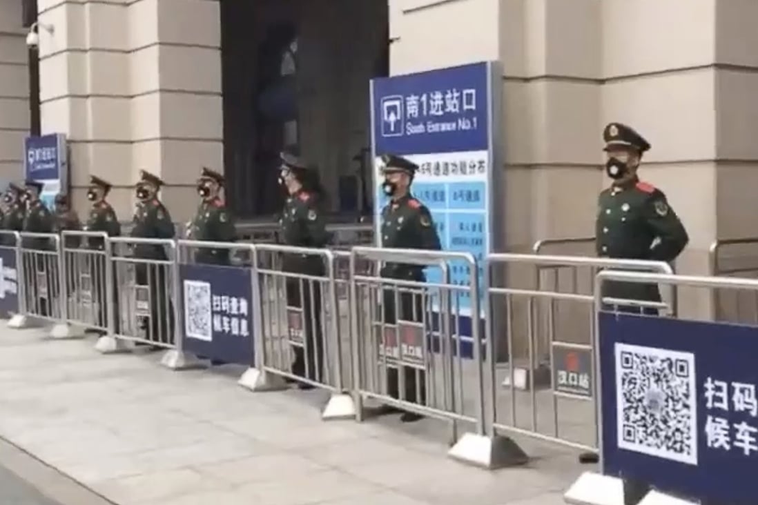 Hankou railway station in Wuhan is guarded after being closed down on Thursday. Photo: Weibo