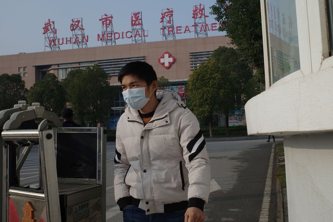 A man leaves a medical centre in Wuhan, where the coronavirus is thought to have originated. Photo: AFP