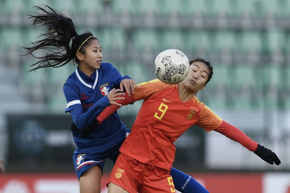 China's Tang Jiali vies for the ball with Taiwan’s Chang Chi-lan during the East Asian Football Federation (EAFF) E-1 Football Championship. Photo: AFP