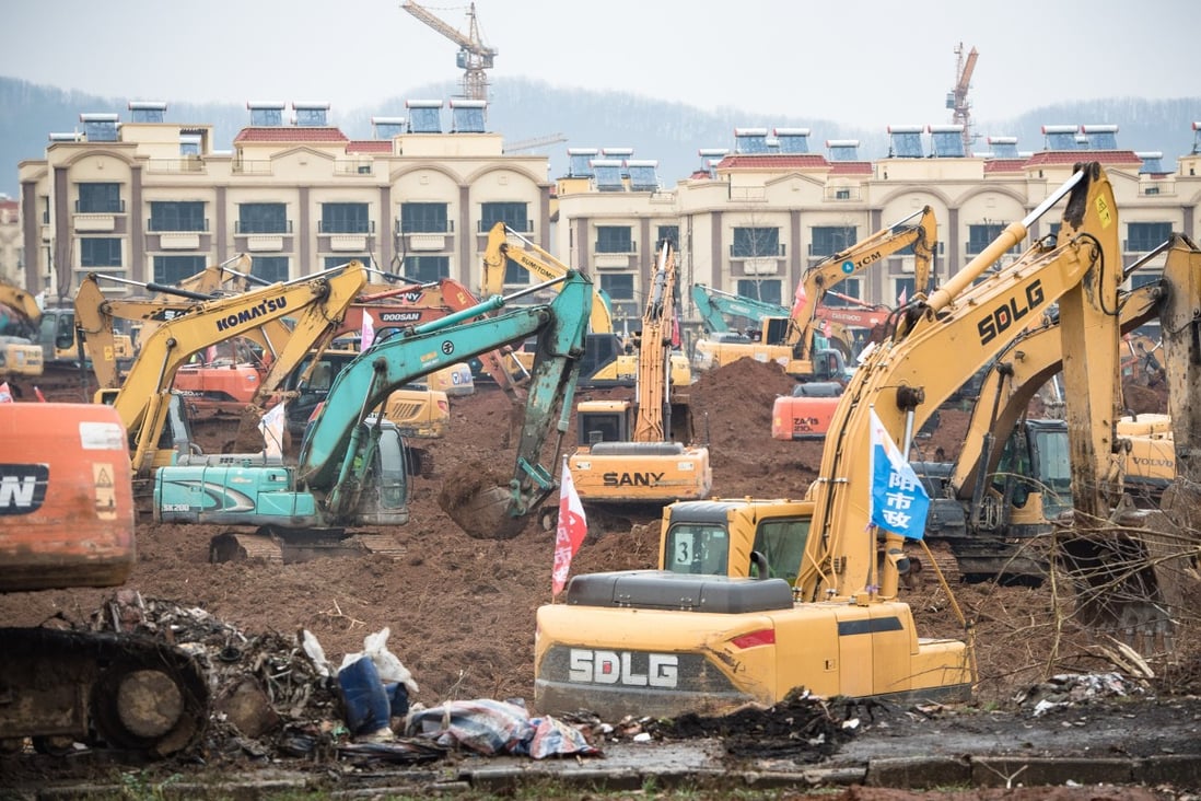 Dozens of excavators break ground for the new coronavirus facility in Wuhan, expected to be completed within six days. Photo: Xinhua