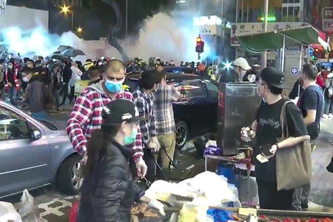 Riot police fire tear gas on Argyle Street near Langham Place in Mong Kok on Saturday January 25, 2020. Photo: RTHK