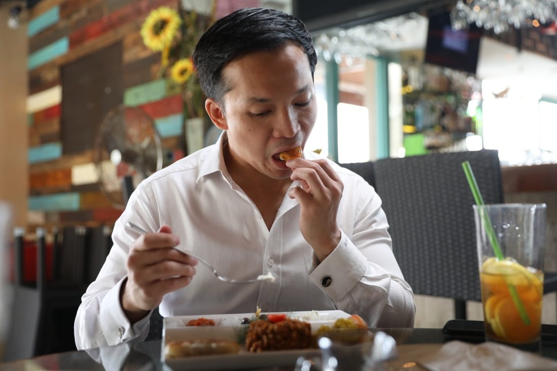 French-Vietnamese MMA fighter Marc Guyon tucks into a vegetarian meal at Hemingway’s restaurant in Discovery Bay, Lantau Island, Hong Kong. Photo: Winson Wong
