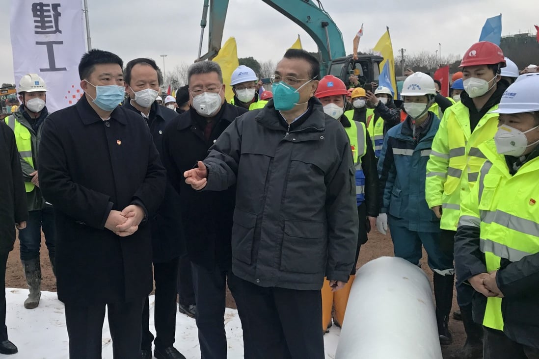 Chinese Premier Li Keqiang (centre) visits the construction site of Huoshenshan, a temporary hospital being built to house 1,000 coronavirus patients. Photo: EPA-EFE