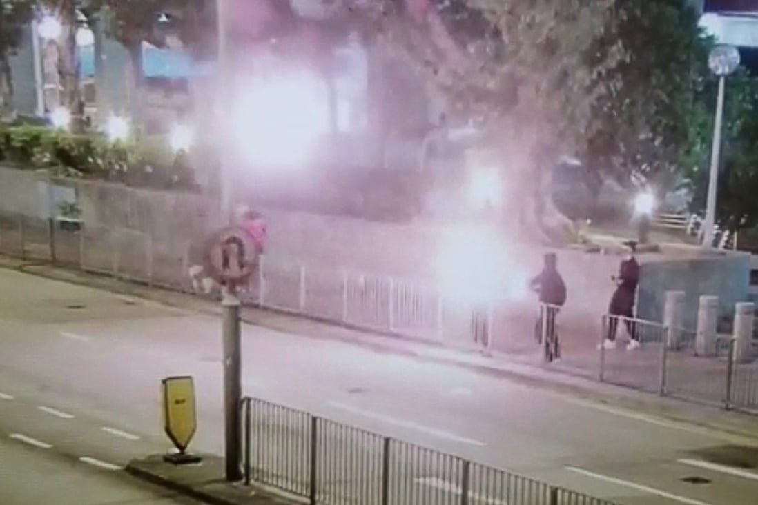 Three protesters throw petrol bombs at Kwai Chung Police Station on January 29. Photo: Handout