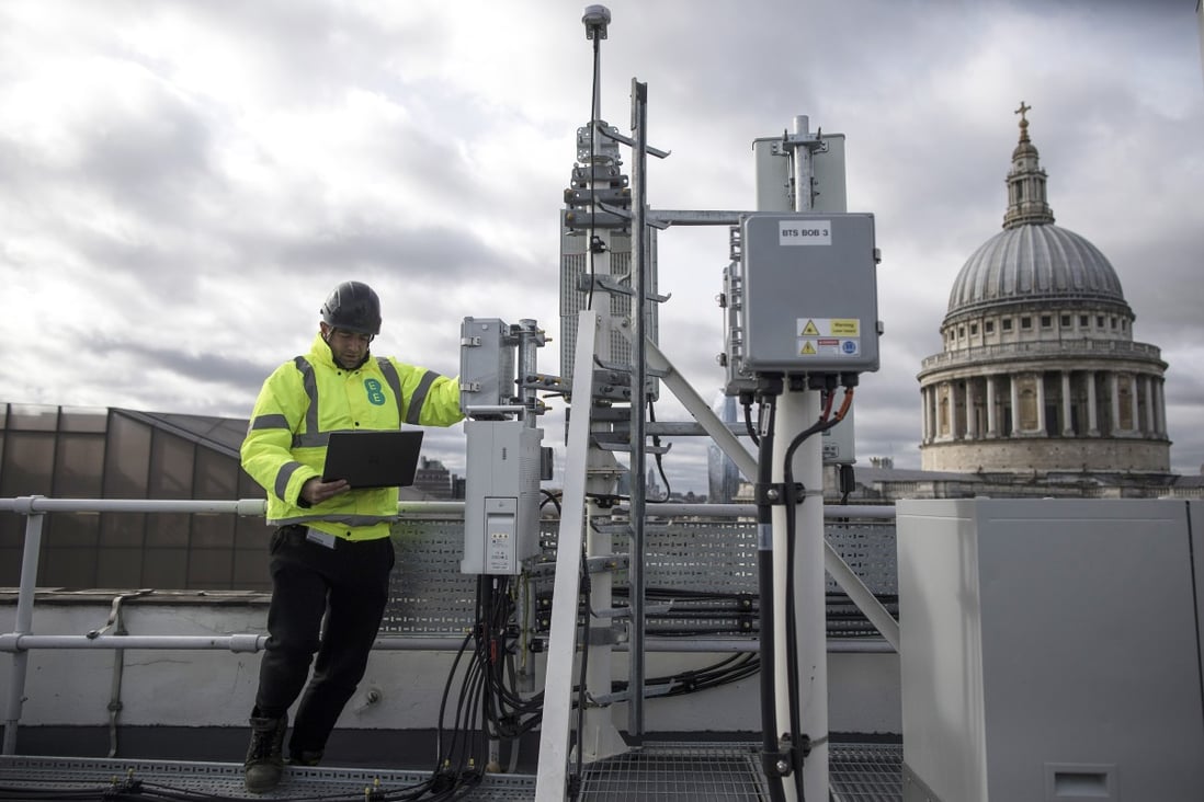 An engineer from mobile services provider EE, owned by telecommunications carrier BT Group, checks Huawei Technologies’ 5G equipment, bottom centre, during network trials in London on March 15, 2019. Photo: Bloomberg